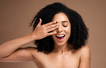 Image showing Hand, face and surprise with black woman and beauty, hair care with shine and skincare with healthy skin glow. Natural curly hair, manicure and cosmetic care with facial against studio background