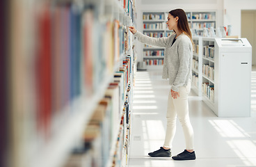 Image showing Woman, student and research in library for books, knowledge or learning at bookstore for education. Female looking at bookshelf in study for project, assignment or thesis for college scholarship