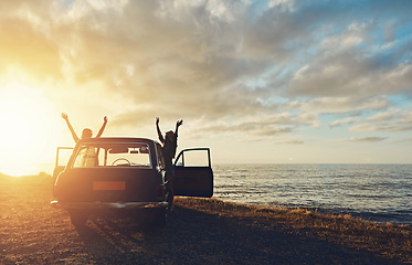 Image showing Friends, silhouette and sunset at beach with car, sky and hands in air for freedom, celebration and happy. Summer sunshine, holiday and ocean with vintage suv, travel and women by waves for happiness