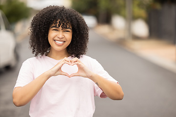 Image showing Heart hands sign, black woman and portrait of a young person in a urban street showing love gesture. African female, happiness and smile with mock up space with hand making emoji shape outdoor