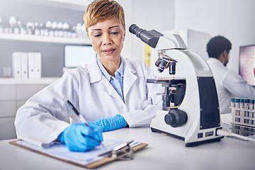 Image showing Senior black woman, research or scientist writing a science report in a laboratory for medical data analysis. Healthcare, focus or doctor working on chemistry paperwork, documents or development