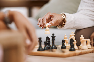 Image showing People, playing hands or chess knight on house, home or living room table in strategy board game, checkmate vision or contest. Zoom, women or competition friends and chessboard pawn in mind challenge