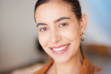 Image showing Portrait, face and beauty with a woman, happy indoors with her cosmetic skincare products or routine. Teeth, makeup and smile with an attractive young female posing inside with natural glowing skin