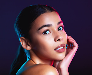 Image showing Beauty, neon shadow light and portrait of woman with dark lighting, facial cosmetics and skincare glow. Luxury studio makeup, aesthetic creativity and face model with creative pink blue color design