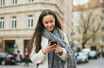 Image showing Travel, phone or woman on social media in city of Paris walking on a relaxing holiday vacation or weekend. Smile, chat or happy girl tourist typing or texting a message on social networking website