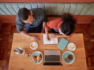 Image showing Creative, writing and small business partnership in cafe for startup, brainstorm and planning by business people. Coffee shop, owners and man with woman for planning, vision and strategy in notebook