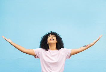 Image showing Black woman, happy and open arms in studio for marketing mockup, happiness celebration and excited in blue background. African girl, smile and surprised hands gesture or surprise growth development