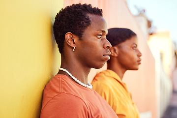 Image showing Urban fashion, African people and couple of friends relax with designer brand clothes, casual style and luxury apparel. Gen z aesthetic, color and profile of black woman and man on orange yellow wall