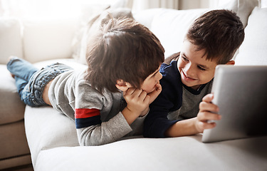 Image showing Kids, bonding or digital tablet for movie streaming, social media or esports gaming on family home sofa. Smile, happy or children brothers on technology for education video, learning support or help