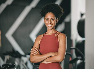 Image showing Black woman, fitness and coach with arms crossed and smile for training, exercise or workout at the gym. Portrait of a confident African American female sports instructor with vision for healthy body