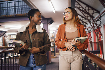 Image showing College students, library books and women talking about education and learning together at university. Friends having conversation about knowledge, studying and research on scholarship while walking