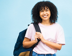 Image showing Student, portrait and woman with backpack in studio for travel, abroad and future dream on blue background. Face, girl and foreign learner excited for journey, experience and education opportunity