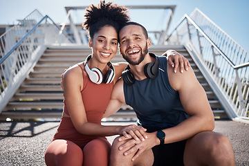 Image showing Couple, fitness and smile with hug in the city for break from running exercise, training or workout on steps. Portrait of happy man and woman smiling in relax for healthy cardio exercising outside