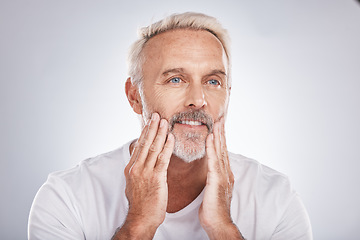 Image showing Mature man touching skincare, facial beauty and barber grooming service on studio background. Male model feeling clean face, beard and moisturizer for beauty, natural body care and bathroom wellness