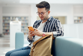 Image showing Library, reading and man with book on sofa for education, studying and academic research. University, scholarship and student with backpack learning, reading book and knowledge in college bookstore