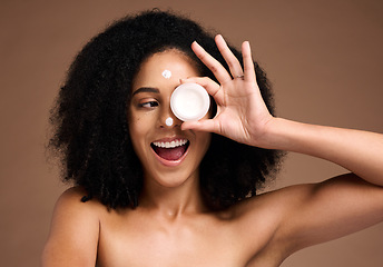 Image showing Cream container, skincare and black woman in studio happy for facial product, natural cosmetics or beauty mockup. African model with wow face for serum, collagen or dermatology sunscreen in her hand