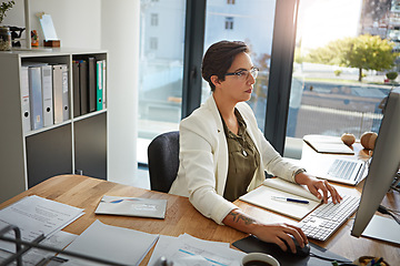 Image showing Office, planning and business woman with computer typing online documents, website research and writing email. Corporate networking, and busy female employee at desk with focus, strategy and ideas