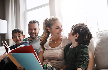 Image showing Love, parents and brothers with a book, sofa and bonding on weekend, loving and learning together. Family, mother and father with boys, child development and reading on couch in living room and relax