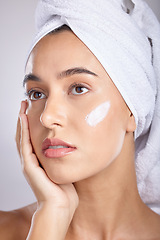 Image showing Woman, head towel and cream for skincare, wellness and organic facial for face detox on grey studio background. Female, lady or makeup for natural beauty, confident and cosmetics for grooming routine