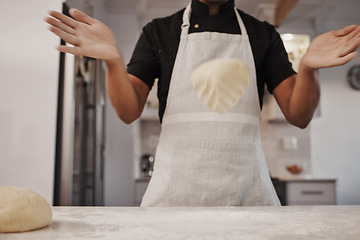 Image showing Baking, dough and hands of a cook in the kitchen for cooking food, bread or a pastry in a bakery. Fast food, job and man preparing a breakfast, lunch or dinner on a table of a shop for a meal