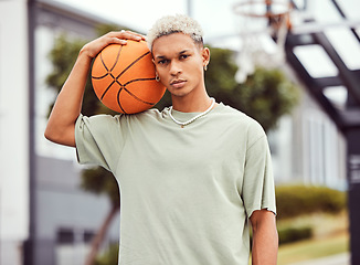 Image showing Fashion, fitness or portrait of black man with basketball in training practice, workout or exercise on city basketball court. Sports, game or male model with cool trendy clothes, Motivation or talent