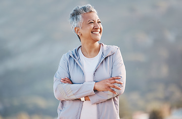 Image showing Senior woman, fitness exercise and relax outdoor for calm vision, freedom and sports workout in nature. Cardio lifestyle, elderly person and happy athlete thinking on mountain top with crossed arms