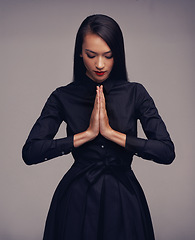 Image showing Fitness tai chi, martial arts and woman with prayer hands in studio isolated on gray background. Face, karate meditation and female fighter with hand gesture ready for workout, exercise or training.