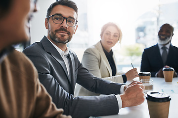 Image showing Meeting, vision and strategy with a business man in the boardroom with his team for a strategy workshop. Planning, mindset and teamwork with an employee group in the office for collaboration