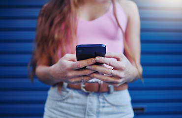 Image showing Woman, hands and phone for social media, texting or chatting in communication or networking. Hand of female, person or lady typing on mobile smartphone for browsing, advertising or conversation