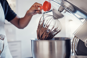 Image showing Baking, food and man with a machine for mixing, cooking and preparing a cake with ingredients. Snack, meal and hands of a baker making a dessert with an appliance in the kitchen for a career