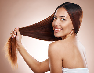 Image showing Hair care, beauty salon and woman portrait with growth and shine shampoo for strong texture on studio background. Portrait of female aesthetic model posing for hairdresser, health and wellness mockup