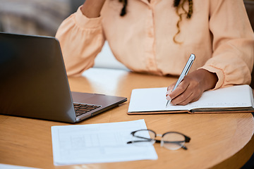 Image showing Hand, writing and pen with a freelance black woman doing remote work using a laptop in her home. Norebook, documents and computer with a female freelancer doing business in her house or office