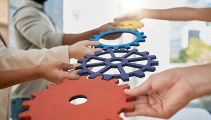 Image showing Business people, toys and gears at job for teamwork, sign or symbol with solution, trust and solidarity. Corporate group, learning or development at team building exercise in city workplace for goals