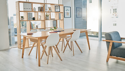 Image showing Business, empty meeting room and office, creative space for idea planning with bright interior furniture. Boardroom, design startup and city workplace for teamwork in sunny urban building with nobody