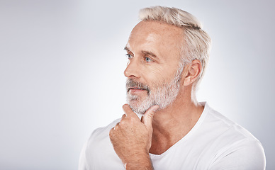 Image showing Face, thinking and senior man in studio isolated on a gray background mock up. Skincare, cosmetics and retired elderly male lost in thoughts or contemplating ideas for beauty, grooming and wellness.