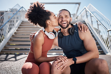 Image showing Sports, love and woman kissing man on stairs in city on break from exercise workout. Motivation, health and fitness goals, couple rest and kiss with smile on morning training run together in New York