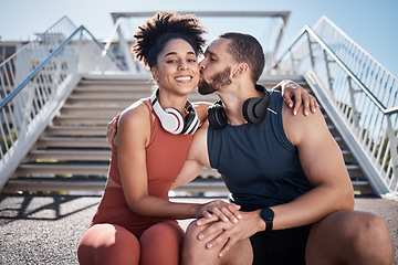 Image showing Sports, love and man kissing woman on stairs in city on break from exercise workout. Motivation, health and fitness goals, couple rest and kiss with smile on morning training run together in New York