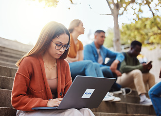 Image showing University, woman sitting stairs and laptop research for school project with focus and motivation for education. College, scholarship and student on steps on campus with computer studying for exam.