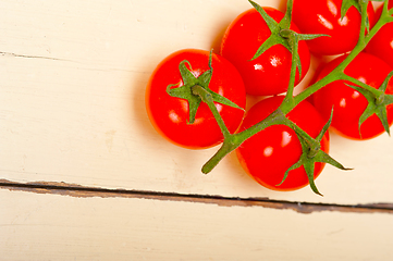 Image showing fresh cherry tomatoes on a cluster