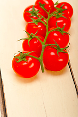 Image showing fresh cherry tomatoes on a cluster