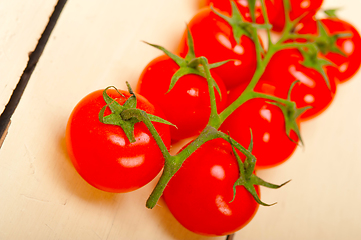 Image showing fresh cherry tomatoes on a cluster