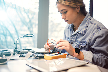 Image showing Engineering, college student and electronics with woman learning for electrical project. Education, engineer female or technician with technology voltage meter for electricity and innovation in class