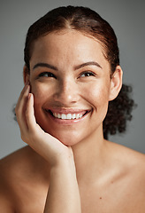 Image showing Face, beauty and skincare of woman in studio isolated on a gray background. Thinking, makeup cosmetics and happy female model satisfied with spa facial treatment for glowing, healthy or flawless skin