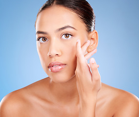 Image showing Face portrait, beauty skincare and woman in studio isolated on a blue background. Makeup, cosmetics and young female model with healthy, glowing and flawless skin after luxury spa facial treatment.