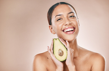 Image showing Skincare, beauty and portrait of woman with avocado on brown background for wellness, cosmetics and detox. Luxury spa, aesthetic and face of girl for organic, natural and healthy facial treatment