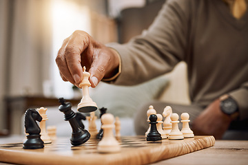 Image showing Man, playing hands and chess king in house, home living room or apartment in winner strategy, checkmate or board game success. Zoom, chessboard and winning pawn in thinking mind challenge or activity