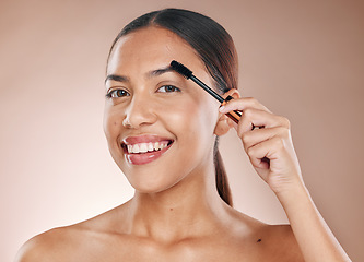 Image showing Beauty portrait and eyebrow brush of woman for grooming routine with natural skincare and smile. Young cosmetic girl model with healthy skin brushing facial hair on beige studio background.