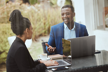 Image showing Businessman, black woman and meeting on terrace for strategy, finance goal and business trip with laptop. Business people, morning business meeting and patio with focus, collaboration and planning
