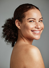 Image showing Portrait, face and skin with a model black woman in studio on a gray background for beauty or skincare. Facial, wellness and natural with an attractive young female posing to promote cosmetics