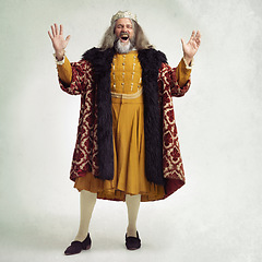 Image showing Ancient king man, screaming and studio with laugh, funny and renaissance fashion by backdrop. Medieval royal leader, clothes and laughing with crown, happiness and robe for power, success and luxury